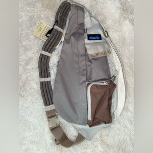 Kavu Tan Sling Backpack with Front Zipper Pocket